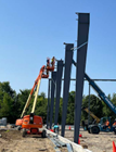 Machines inserting steel beams 